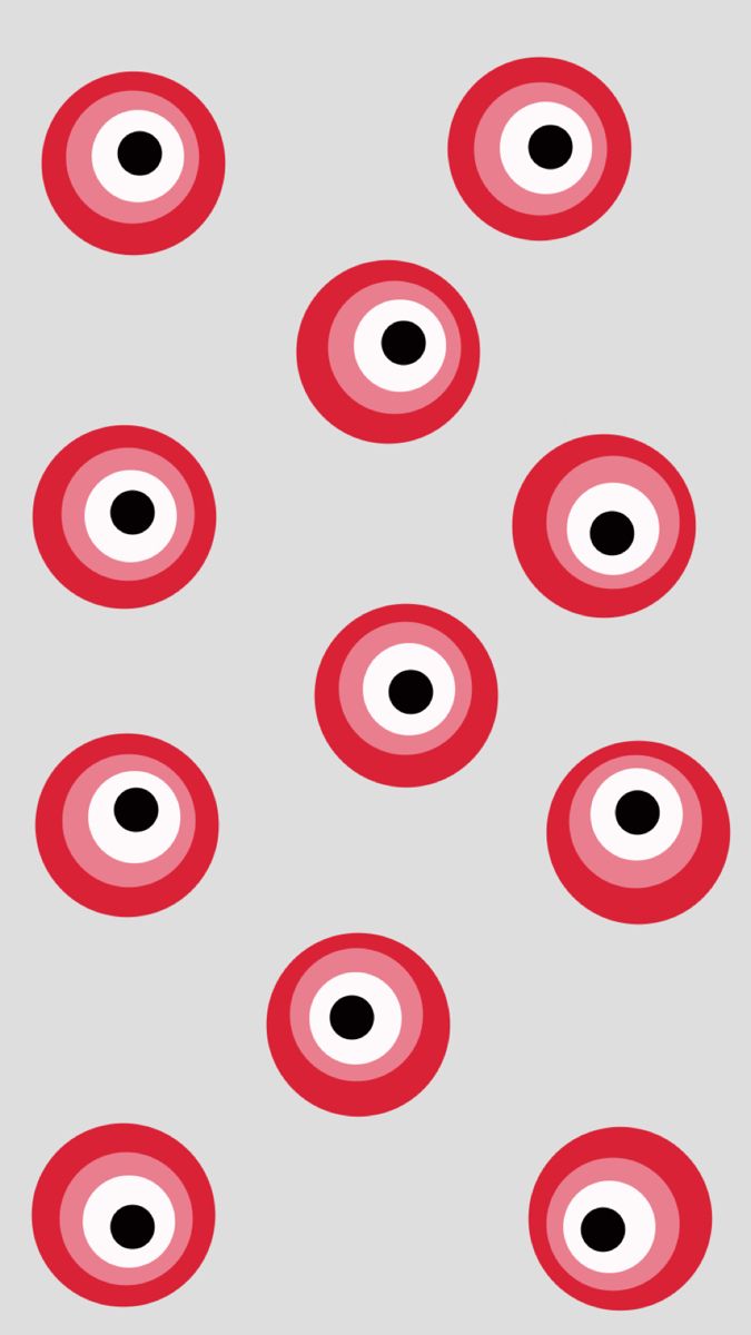 red and black circles are arranged in the shape of an eye on a gray background