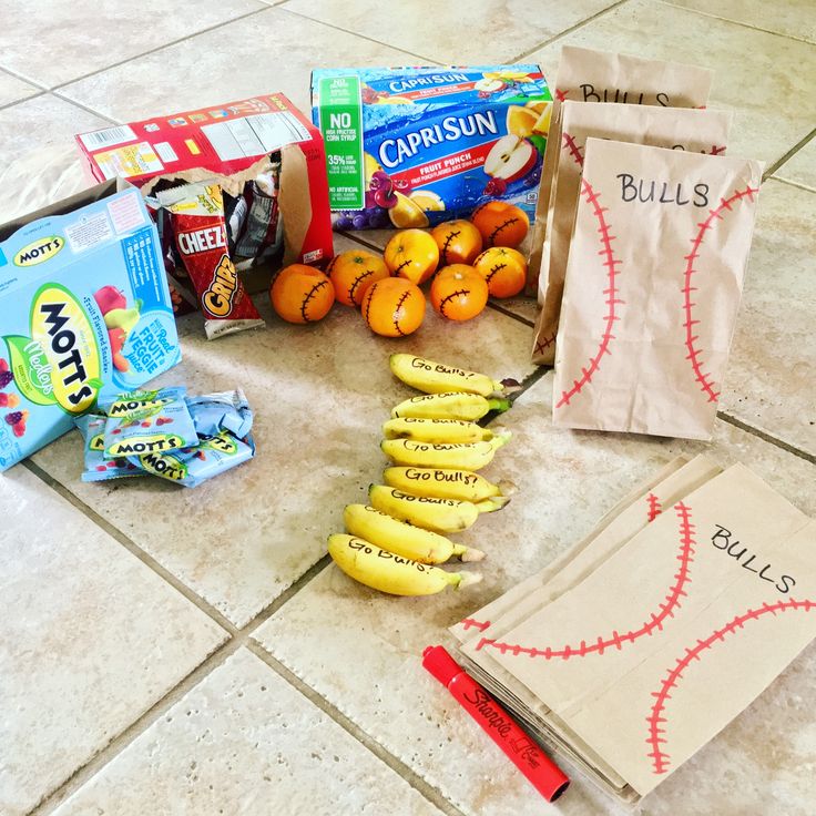 a bunch of fruit and snacks on the floor