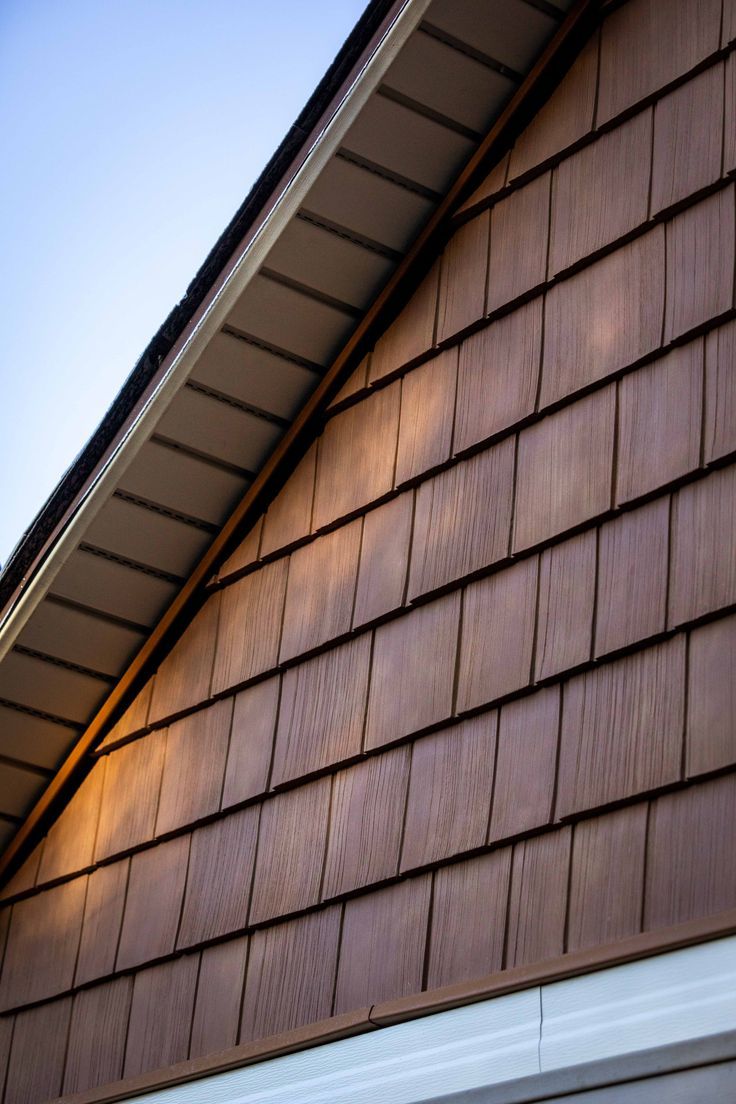 cedar vinyl siding on a house in an amber orange brown color Shaker Siding Exterior, Vinyl Siding Ideas Exterior, Bungalow Exterior Colors, Vinyl Siding Ideas, Cedar Shake House, Cedar Vinyl Siding, Cedar Siding Exterior, Cedar Siding Colors, Vinyl Cedar Shake Siding