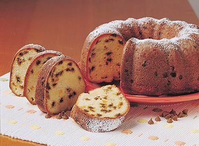 a bundt cake on a plate with slices cut out