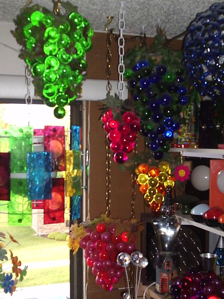 several colorful balloons are hanging from the ceiling