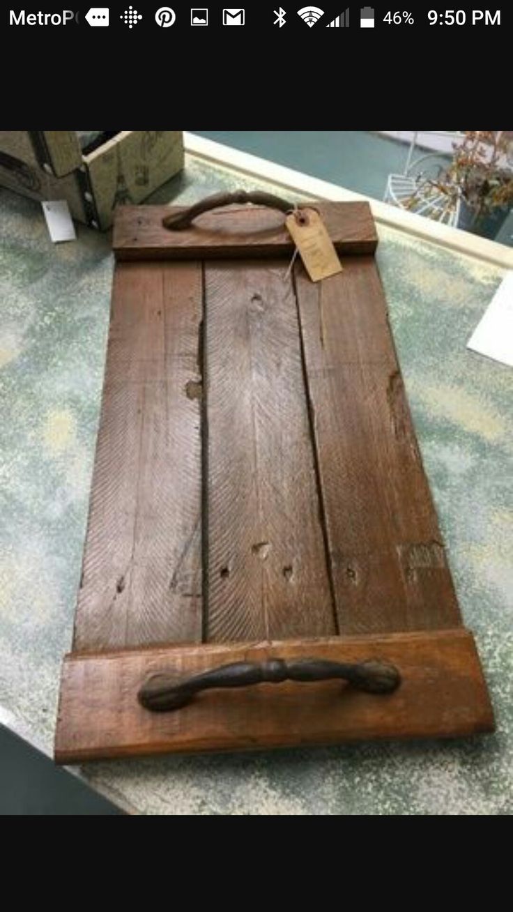 a wooden cutting board sitting on top of a counter