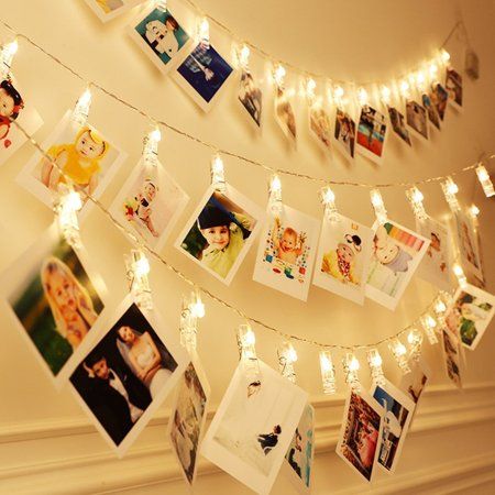 a string of lights with pictures hanging from it