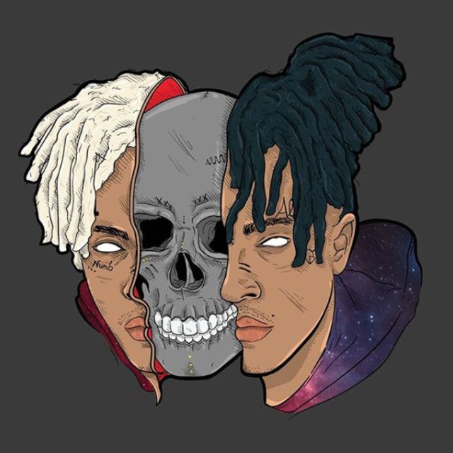 two people with dreadlocks and one has a skull on his head, while the other