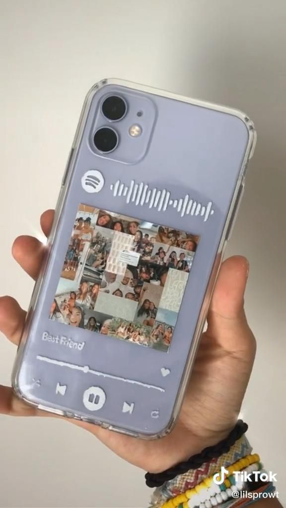 a person holding up a cell phone case with pictures on the front and back cover