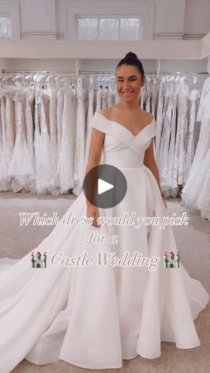 a woman standing in front of wedding gowns