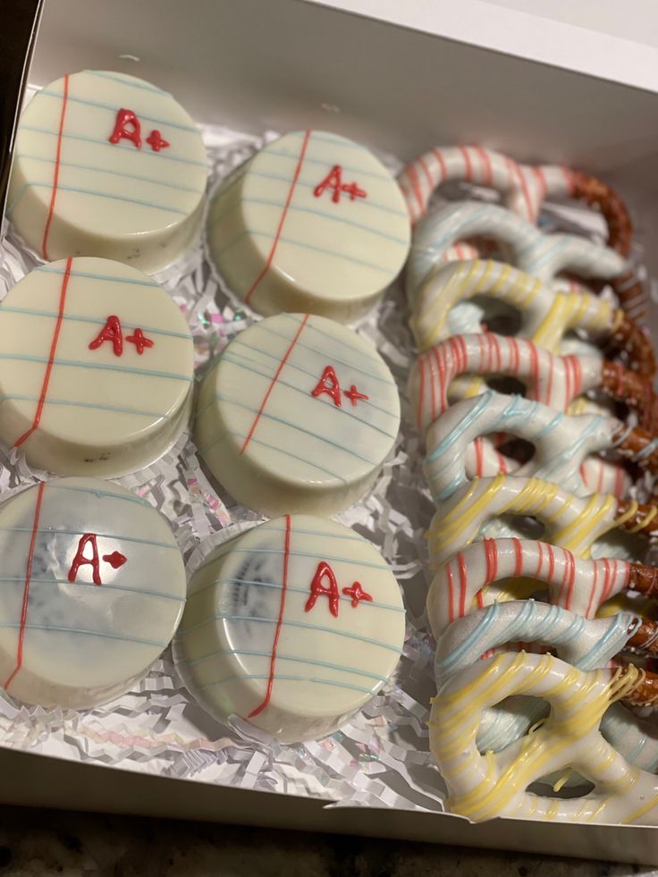 a box filled with lots of donuts covered in frosting