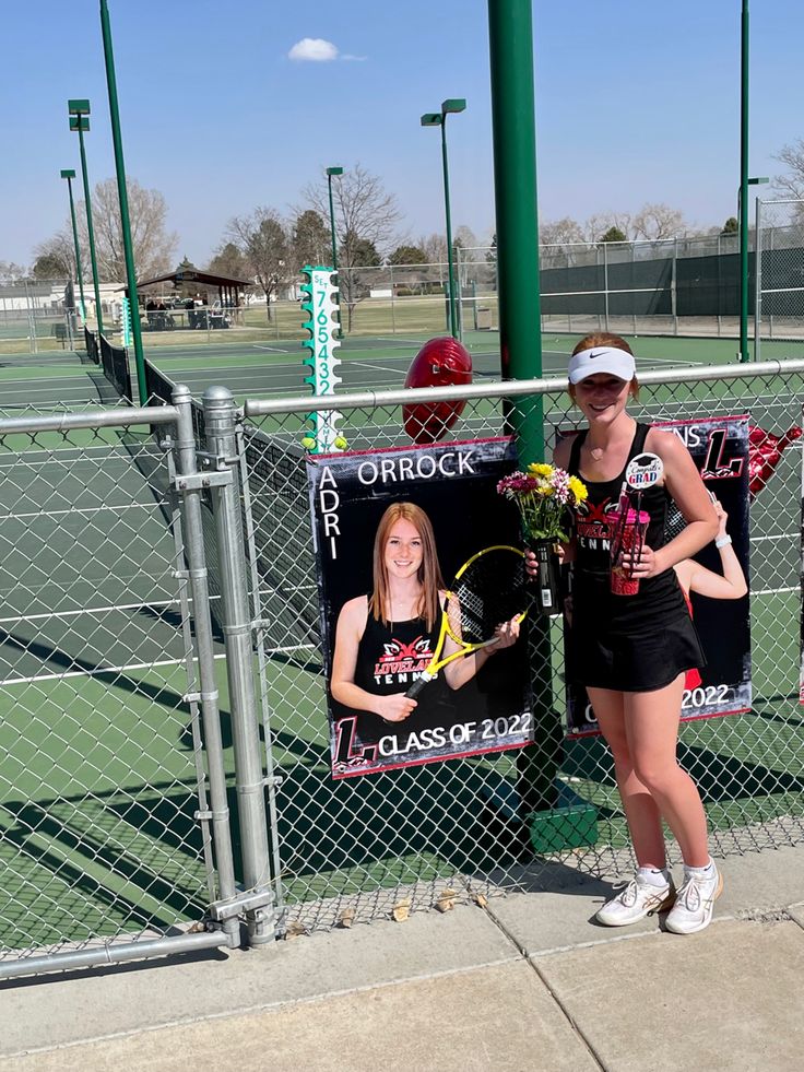 two women standing next to each other on a tennis court