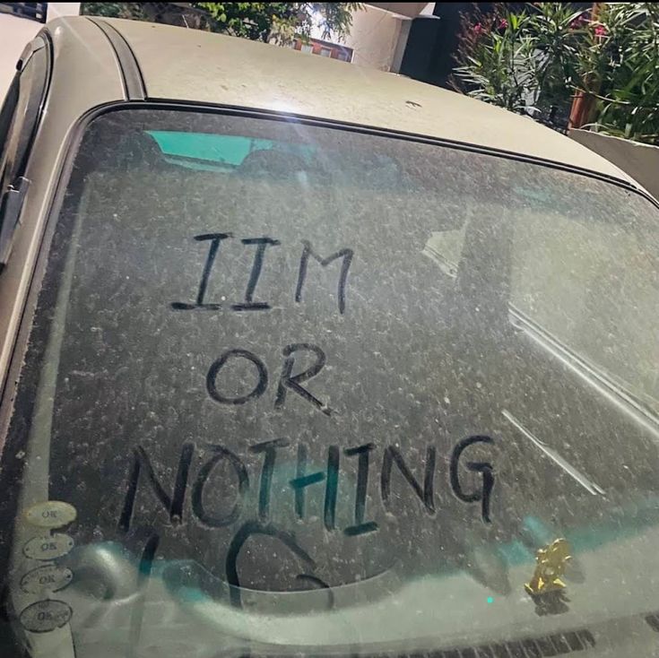 the back window of a car with writing on it that says i'm or nothing