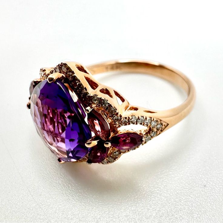 New Diamond And Amethyst Rhodolite Ring 14 K Pink Gold Comes With Certificate Bought This At A Closing Down Sale Of Saks To Then Sell On So It’s Brand New. Approx. Diamond Weight: 0.21 Color/Clarity: H-I / I1-I2 Approx. Gem Weight: 4.85 Size 6.5 Us Luxury Purple Gemstones With Halo Setting, Luxury Purple Multi-stone Rings, Exquisite Amethyst Ring With Accent Stones, Luxury Purple Amethyst Ring With Halo Setting, Luxury Purple Amethyst Gemstones, Formal Purple Amethyst Ring With Gemstone Accents, Elegant Rose Gold Multi-stone Amethyst Ring, Exquisite Amethyst Ring, Elegant Purple Multi-stone Gemstones