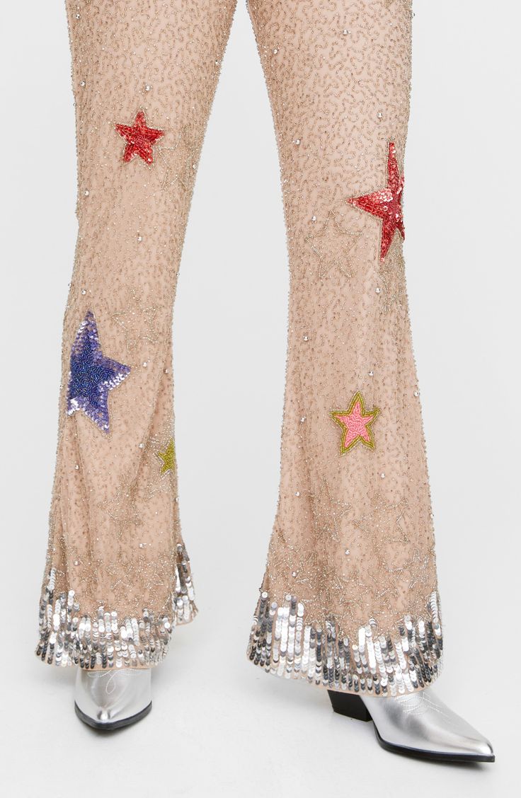 Step out in bold, glamorous style in these elaborately beaded flare-leg pants adorned with sparkly sequins and vibrant stars. Exclusive retailer Hidden side-zip closure 100% polyester Dry clean Imported Multicolor Sequined Bottoms For Party Season, Multicolor Sequined Party Bottoms, Glamorous Multicolor Sequined Bottoms, Multicolor Sequined Party Pants, Multicolor Sequin Party Pants, Flared Sequin Bottoms For Party Season, Flare Pants With Sequins For Party Season, Sequin Flare Pants For Party Season, Multicolor Flare Bottoms For Party