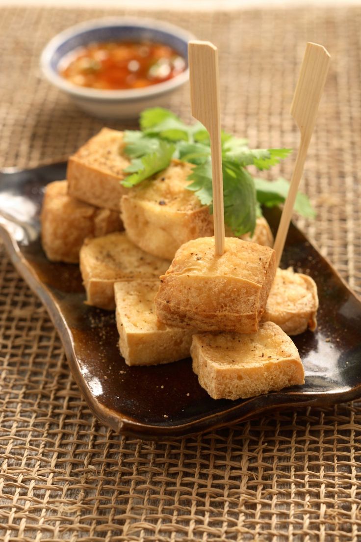 tofu sticks on a plate with dipping sauce