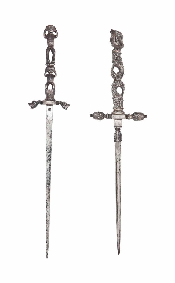 two large metal swords with intricate designs on them