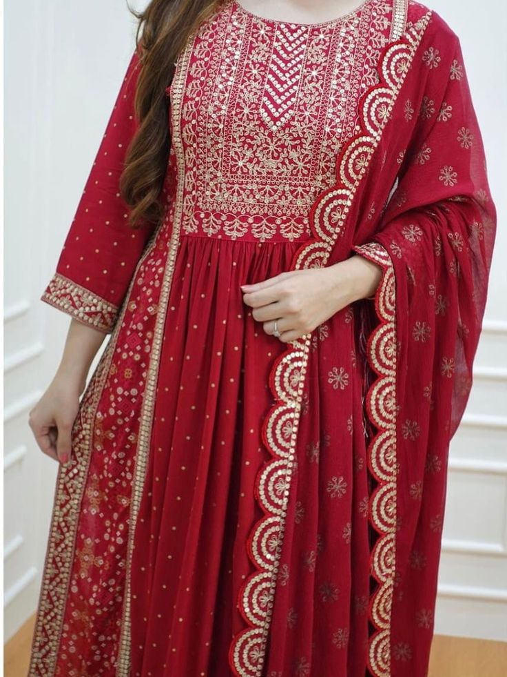 Summer collection kurti pant suit. 3 piece set . Fabric : Cotton fabric anarkali kurti , cotton Dupatta with Zari lining, cotton pants. Work : Printed base , border work with Zari lace. Sequence work . Measurement : Kurti length 44in , pant 38 length, Dupatta 2.10 meters, Elegant Red Cambric Kurta, Elegant Red Cambric Unstitched Suit, Elegant Red Cambric Dupatta, Red Cambric Kurta For Wedding, Red Cambric Kurta With Dabka Details, Red Georgette Lawn Suit With Straight Kurta, Red Lawn Suit With Dupatta In Mulmul, Red Wedding Kurta In Cambric, Red Chanderi Anarkali Lawn Suit