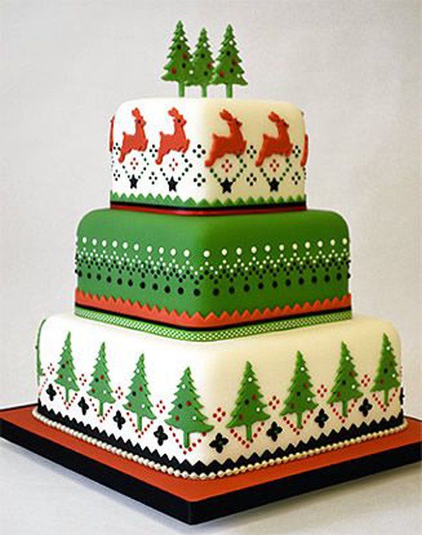 a multi layer cake decorated with christmas trees and deers