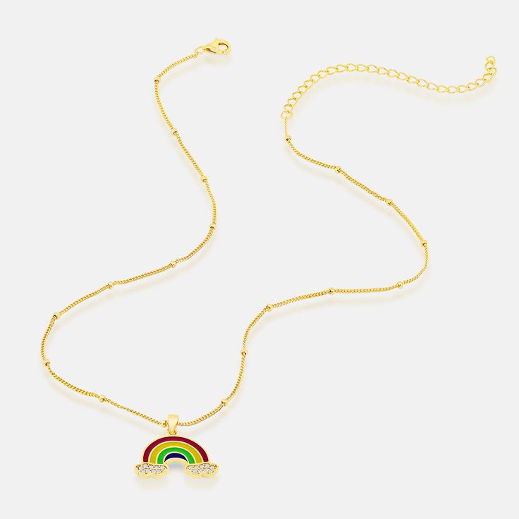 Rock a dazzling dash of color in Em + Liv's CZ Rainbow Necklace, featuring an array of sparkly clouds attached to a dreamy rainbow pendant. Wear this gem with a cute choker, and a vibrant blouse for a chic, layered look that'll make heads turn anywhere you go. Sterling Silver 14K Gold Plated Cubic Zirconia Stones Length: 14" + 3" Extender Trendy Jewelry For Pride Gifts, Trendy Rainbow Jewelry For Pride, Rainbow Choker Necklace As A Gift, Rainbow Choker Necklace As Gift, Trendy Rainbow Necklace For Parties, Trendy Rainbow Choker Necklace, Rainbow Pendant, Gold Bond, Rainbow Necklace