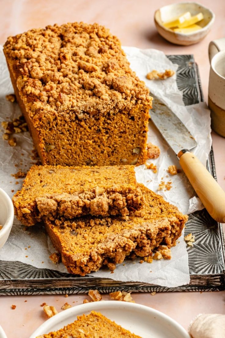 sliced loaf of pumpkin bread sitting on top of a table