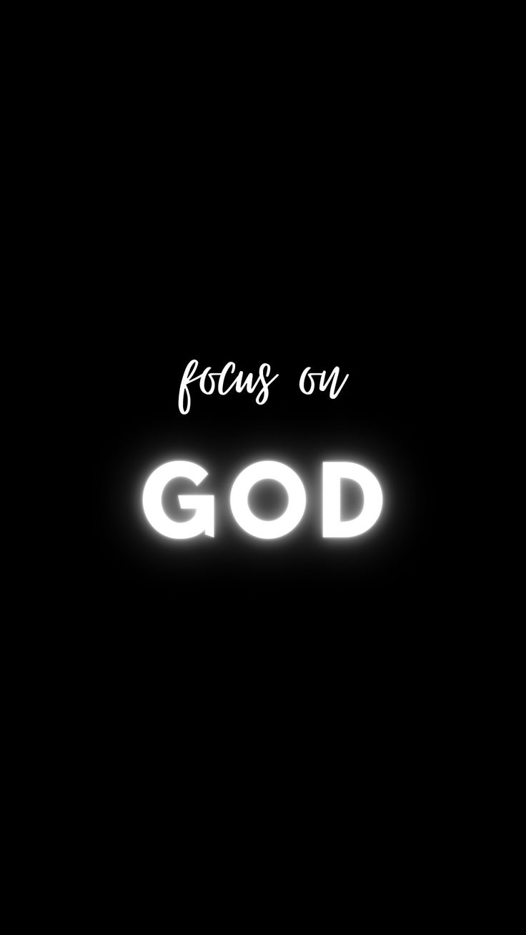 the words focus on god are lit up in the dark with white letters above it