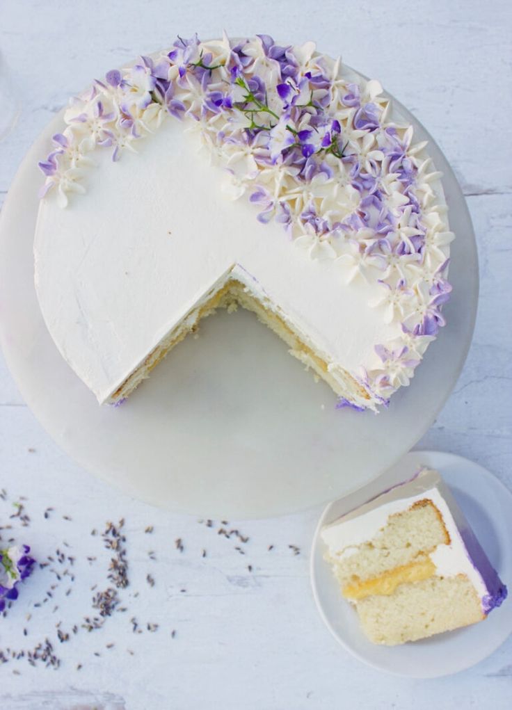 a lemon lavender cake on a white plate with the title text overlaying it