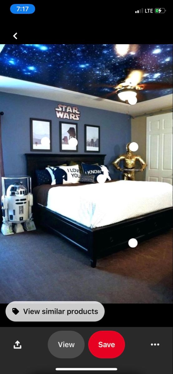 a bed room with a star wars theme on the ceiling