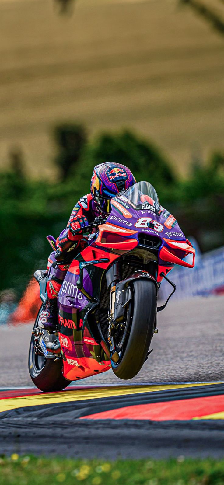 a person riding a motorcycle on a race track