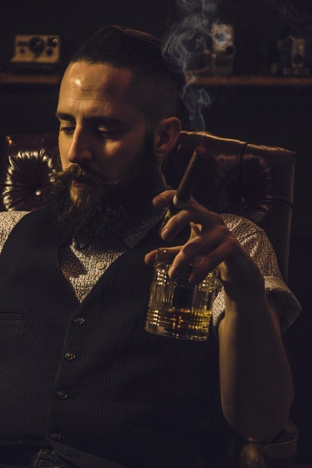 Whiskey Man Aesthetic, Man With Wine Glass Pose, Guy Holding Wine Glass Pose, Man Drinking Whiskey Photography, Whiskey Aesthetic Man, Men Drinking Wine Photography, Holding Whiskey Glass Pose, Bourbon Photoshoot, Man Holding Whiskey