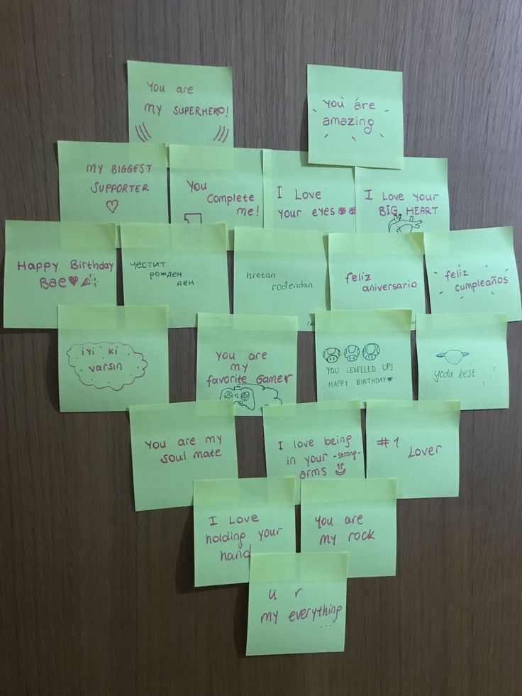 several sticky notes attached to a door with words written on them, all pinned together