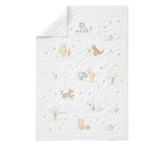 a white blanket with animals and stars on it