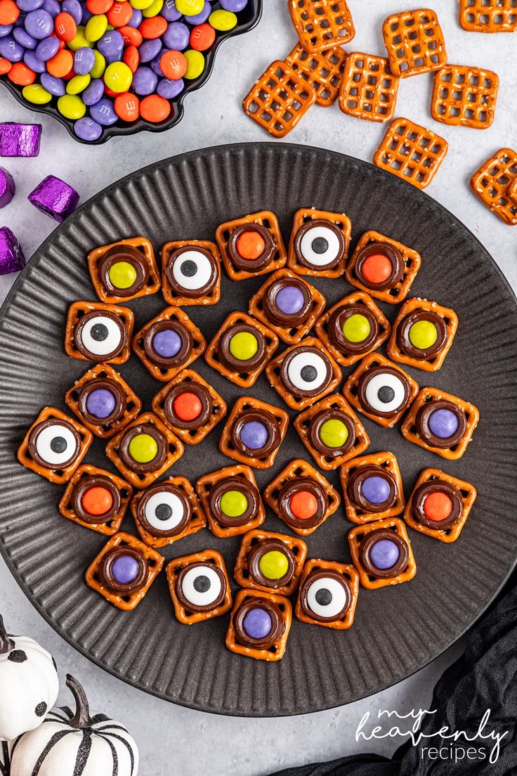 halloween treats are arranged on a plate with candy