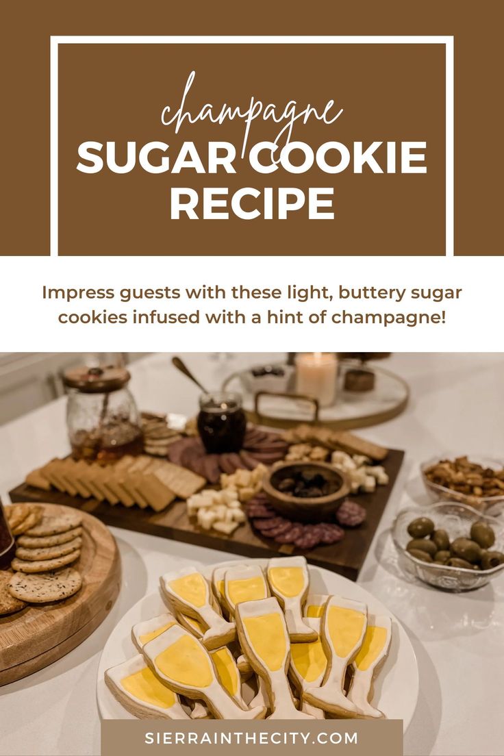 a table topped with lots of cookies and other desserts next to a plate filled with cheese