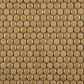 the back side of a wall with circles on it in gold and brown colors,