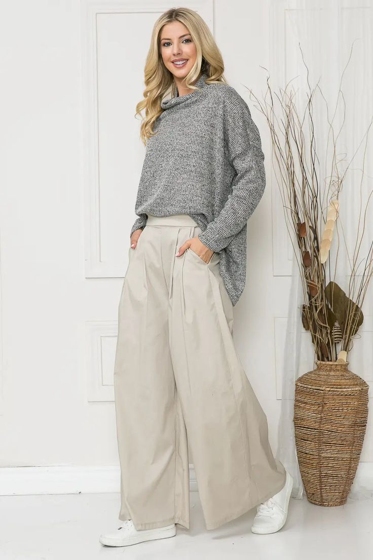 For a sophisticated and elevated look, these wide-leg pants offer an impeccable combination of luxury and comfort. The slight stretch ensures a perfect fit while the front leg pleats, pockets, and elastic waistband at the back add a stylish touch. Wide leg Slight stretch Front pleats Pockets Elastic waist back 29"Inseam Content: 98% Cotton, 2% Elastane Khaki Wide Leg Pants, Cotton Wide Leg Pants, Orange Farm, Farm Clothes, Light Sweater, Pleated Pants, Khaki Color, Effortless Chic, Color Khaki