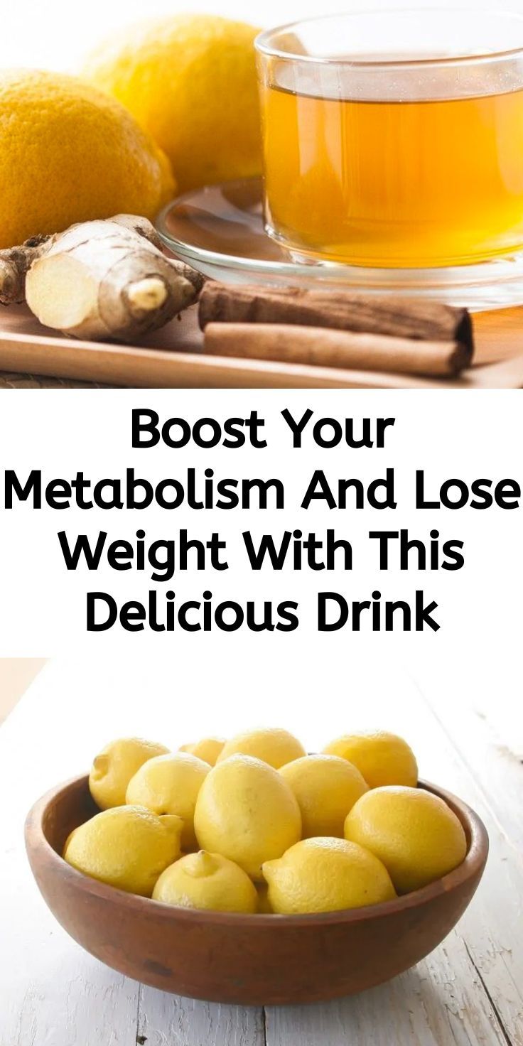 a wooden bowl filled with lemons next to a cup of tea