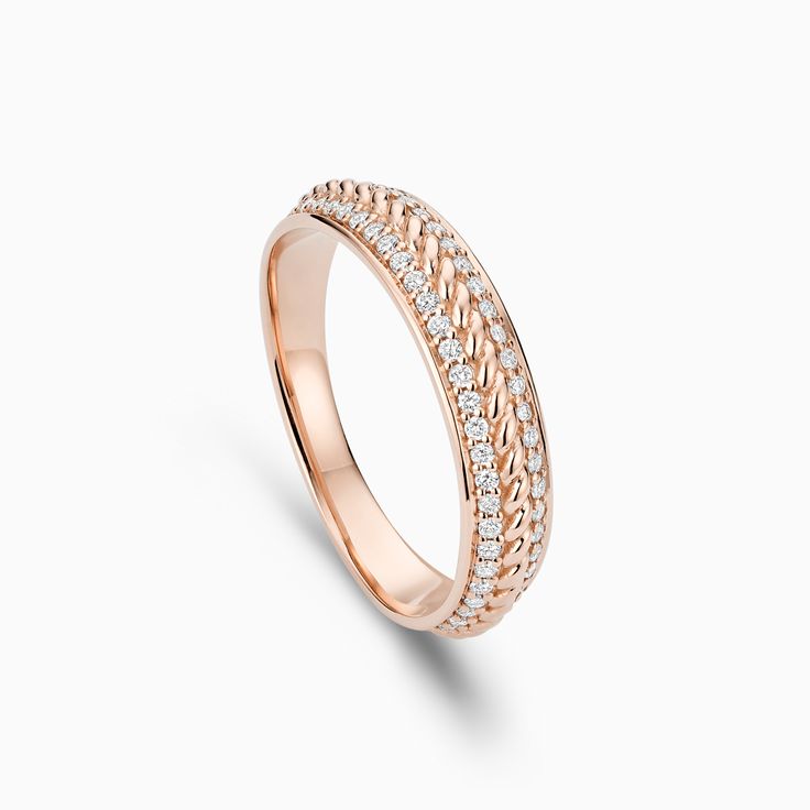 Striking in its elegant simplicity, this Twisted Gold Ring with Diamond Pavé honours the traditional charm of unadorned gold with a modern twist. Like all Ecksand jewels, this ring is handcrafted in our green atelier using high-end recycled gold. Accent diamonds: 0.20+ ctw, VS2+/F+ Setting: Grain setting Elegant White Gold Chain Ring With Round Cut, Refined Promise Ring Jewelry, Elegant Formal Chain Ring With Round Band, Elegant Round Band Chain Ring For Formal Occasions, Elegant Anniversary Chain Ring With Round Band, Elegant Round Band Chain Ring For Anniversary, Elegant White Gold Chain Ring, Elegant White Gold Chain Ring For Wedding, Elegant White Gold Chain Ring For Formal Occasions