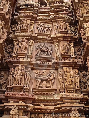 an intricately carved wall with sculptures on it