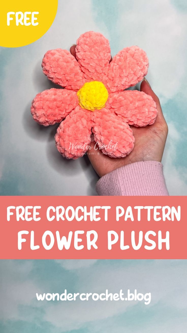 a hand holding a pink flower with the text free crochet pattern flower plush