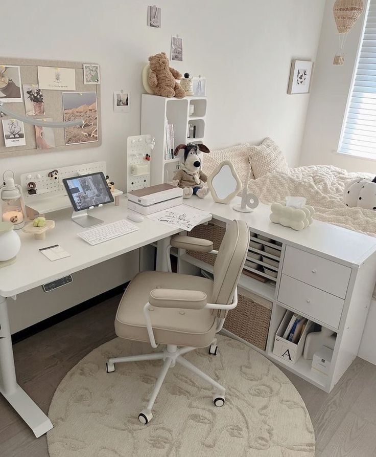 a white desk with a chair and computer on it