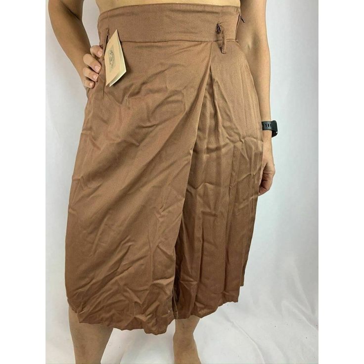 Armani Jeans Tan Orange Skirt Nwt Tan/Orange Colored Armani Jeans Light And Soft Skirt With An Interesting Side Pleat. Size 48 Italian, Fits Like A Size 8/10. Made In Italy. 100% Rayon. In "New With Tags" Condition. Measurements: Waist = 15.5" Length = 26" Size Reference: Model Is A Size 6. Ritacou Online Shop Has An Incredible Variety Of Bargains. Please Visit Us For More Unique, Luxury Items! Relaxed Fit Brown Knee-length Skirt, Brown Relaxed Knee-length Skirt, Relaxed Brown Knee-length Skirt, Knee-length Relaxed Brown Skirt, Relaxed Knee-length Brown Skirt, Long Skirt With Pockets For Daywear, Brown Cotton Knee-length Bottoms, Brown Knee-length Bottoms For Summer, Solid Pleated Beach Bottoms