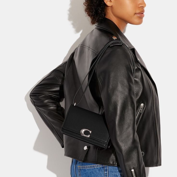 Don’t let its name fool you: the put-together Bandit is as sophisticated as they come. Detailed with our C pushpin closure this flap front crossbody is crafted of luxe refined leather with a high shine finish. The dual compartment design features a secure interior snap pocket a convenient exterior pocket and a shoulder strap that adjusts for crossbody wear. (But be warned it may steal your heart). | Coach Bandit Crossbody Bag - Women's Designer Crossbody - Silver/black Timeless Evening Flap Bag With Cc Turnlock Closure, Chic Shoulder Bag With Cc Turnlock And Double Flap, Trendy Coach Shoulder Bag For Evening, Leather Flap Bag With Cc Turnlock For Evening, Coach Evening Shoulder Bag, Chic Business Flap Bag With Cc Turnlock Closure, Coach Bandit Shoulder Bag, Coach Evening Flap Bag With Adjustable Strap, Chic Double Flap Bag