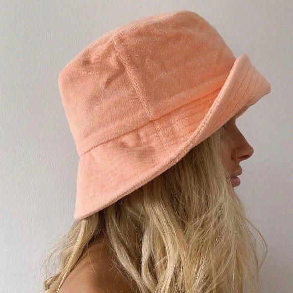 Introducing our cool and simple terry towel bucket hats. Made from 100% terry towelling, the Wave Bucket is soft and durable + perfect for beach days. Throw on this easy to wear style for a sun-safe, street look. Brimmed bucket hat design in pastel Peach Featuring small side pocket ;) 100% cotton terry cloth Spot clean / hand wash This hat is accredited with a UPF Rating 50+ (Australian Tested) Size + Fit: Designed for a relaxed fit, our buckets should be comfortable for wearer and snug in fit ( Bucket Hat Design, Lack Of Color, Color Wave, Terry Towel, Street Look, Clean Hands, The Wave, Girl With Hat, Katy Perry