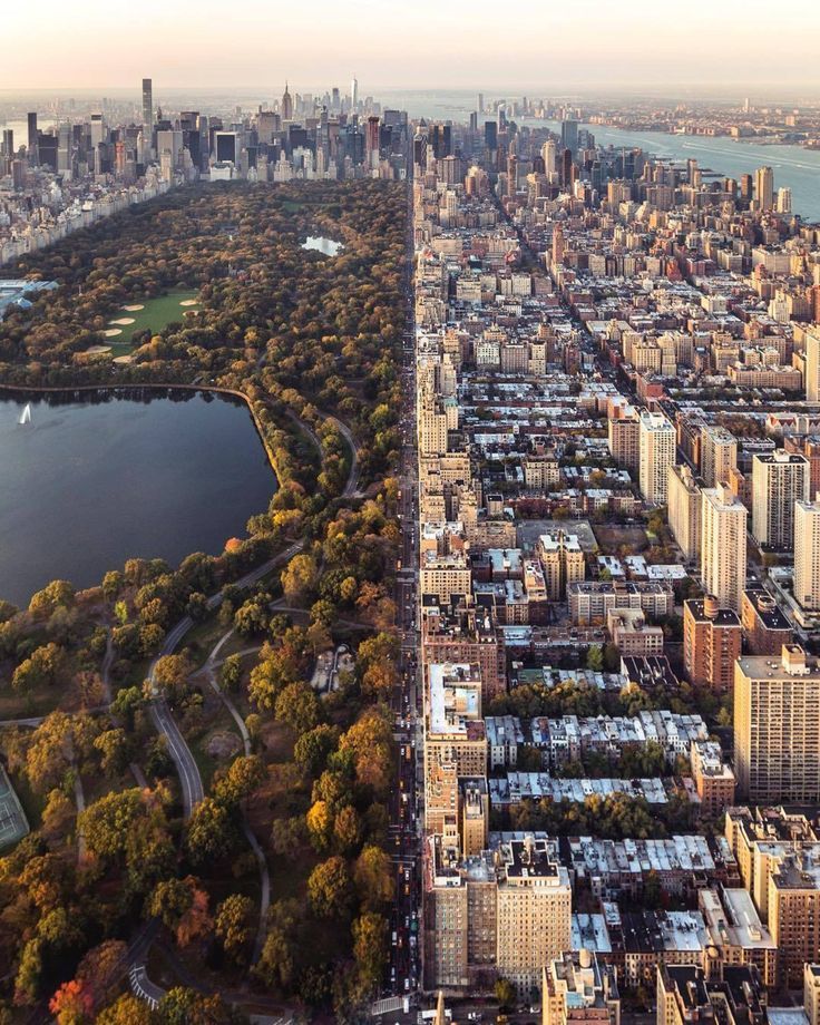 an aerial view of the city and lake