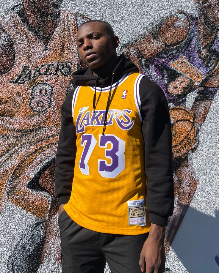 For all the ballers. The Los Angeles Lakers Dennis Rodman '98-'99 Swingman Jersey is made with breathable polyester mesh with side vents to keep you cool. It's lined with anti-irritation ribbed trim at neckline and armholes for added comfort. Finished with player and team graphics and the NBA patch on the left shoulder for an on-court look.  - Knit 1x1 ribbed neckline and armholes - Screen-printed twill number applications - NBA logo is applied at upper left shoulder - Mitchell & Ness HWC Swingm Lakers Jersey Outfit Men, Laker Jersey Outfit Men, Nba Jersey Outfit Men, Jersey Outfit Men, Nba Jersey Outfit, Throwback Jerseys, Basketball Jersey Outfit, Lakers Jersey, Nba Fashion