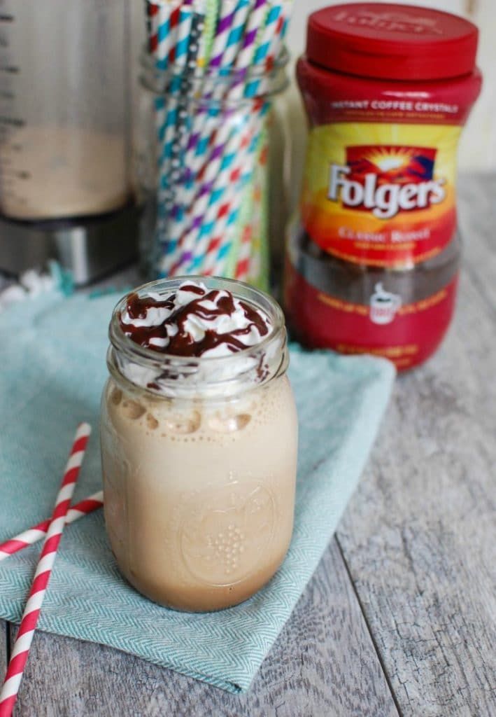 a mason jar filled with whipped cream and chocolate