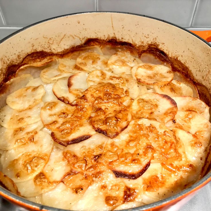 a pan filled with bananas sitting on top of a stove