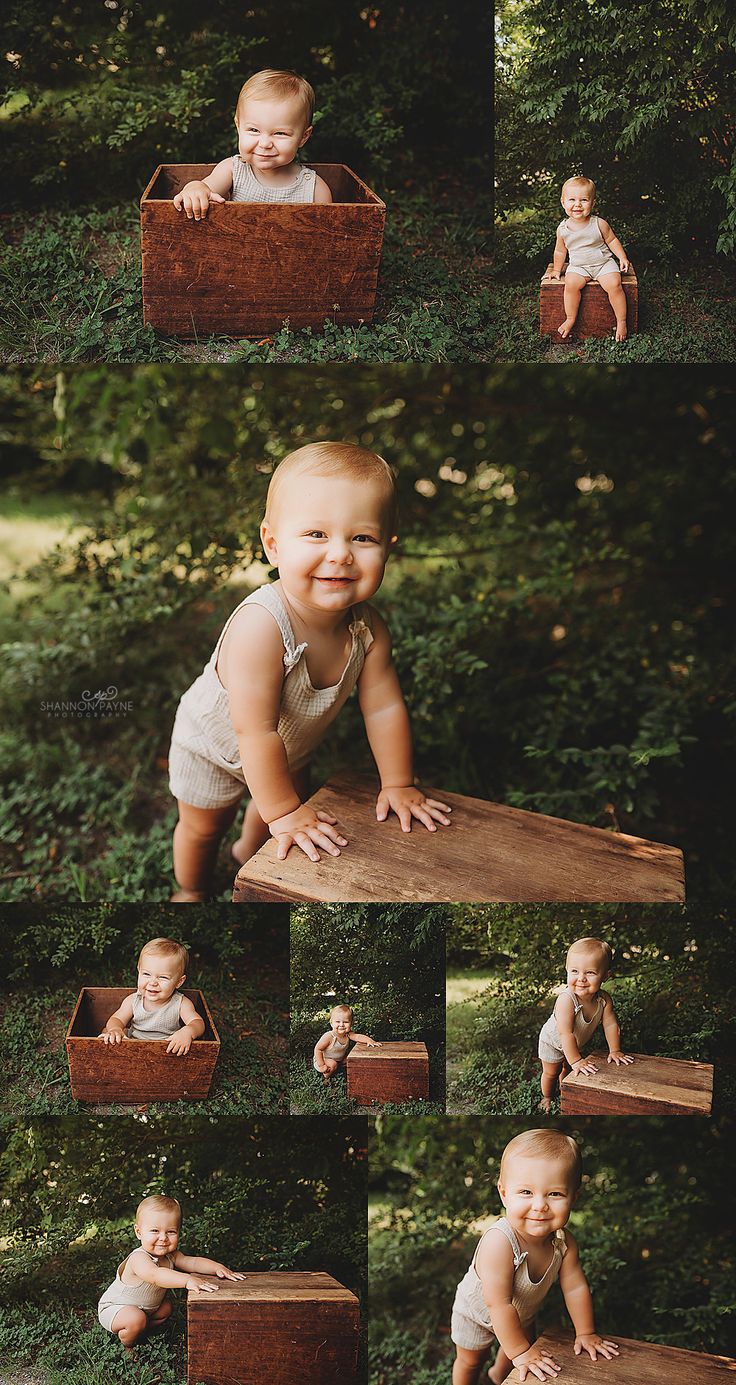 a baby is smiling and sitting in a wooden box with his hands on the ground