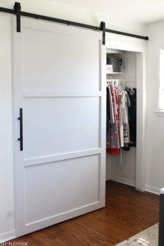 the sliding door is open to reveal what's in the closet and how it looks like