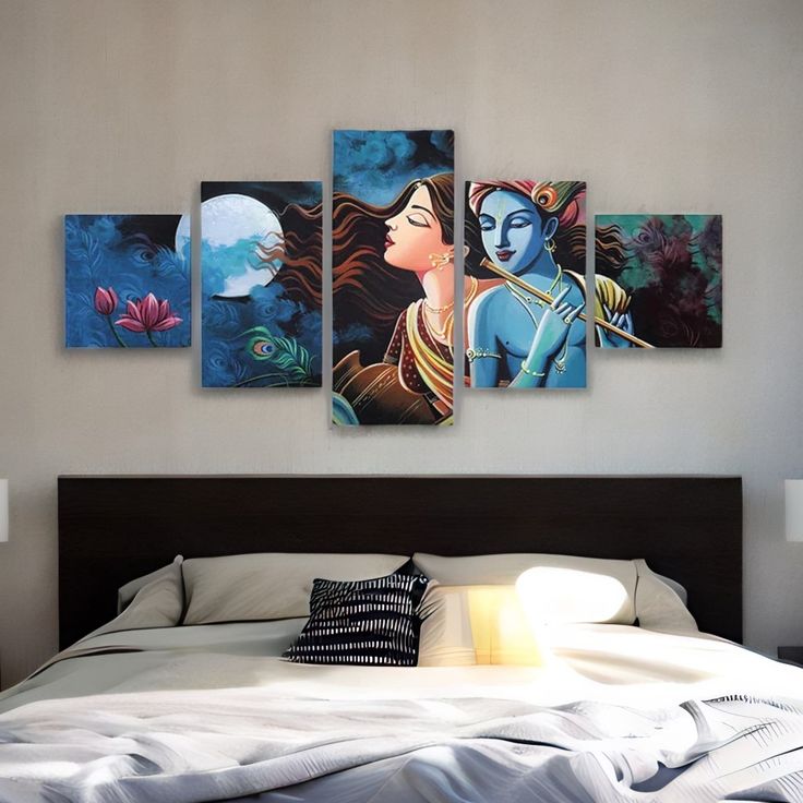 a bed room with a neatly made bed and paintings hanging on the wall above it