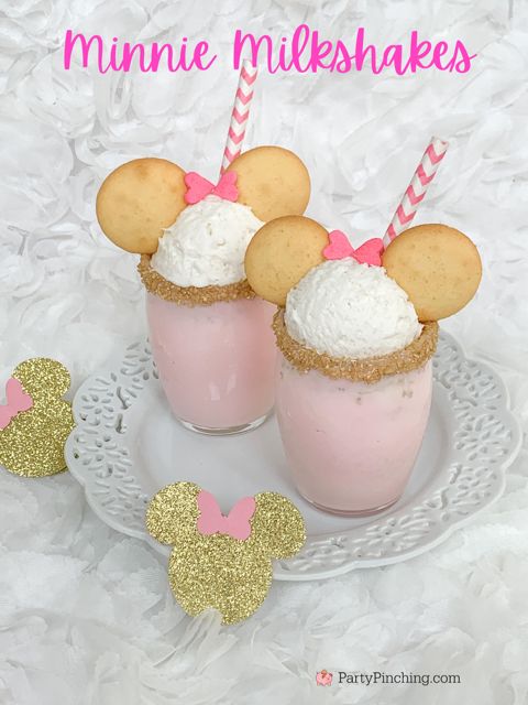 minnie mouse milkshakes on a plate with pink and gold straws