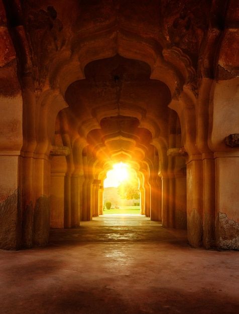 an archway with light coming through it