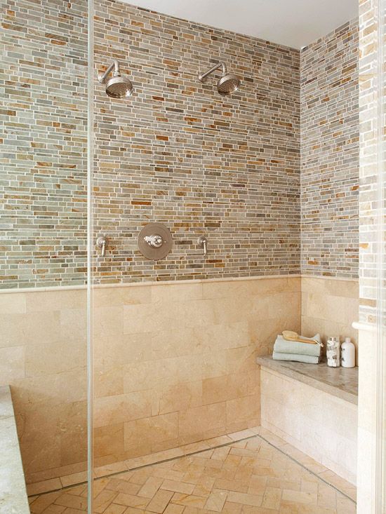 an image of a bathroom setting with tile on the walls and shower in the corner